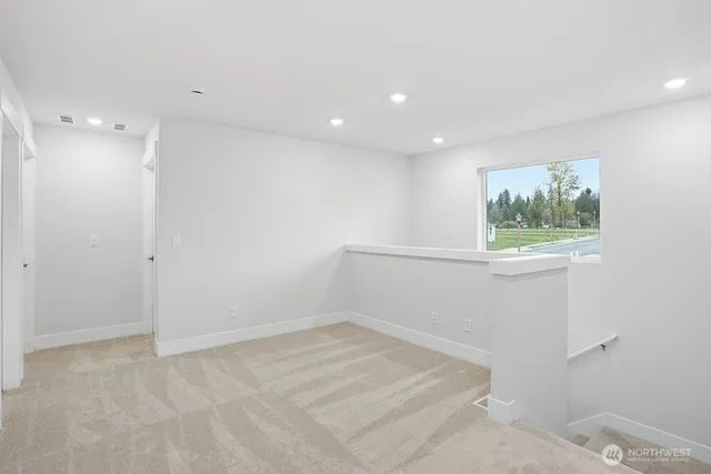 a view of room with window and hallway