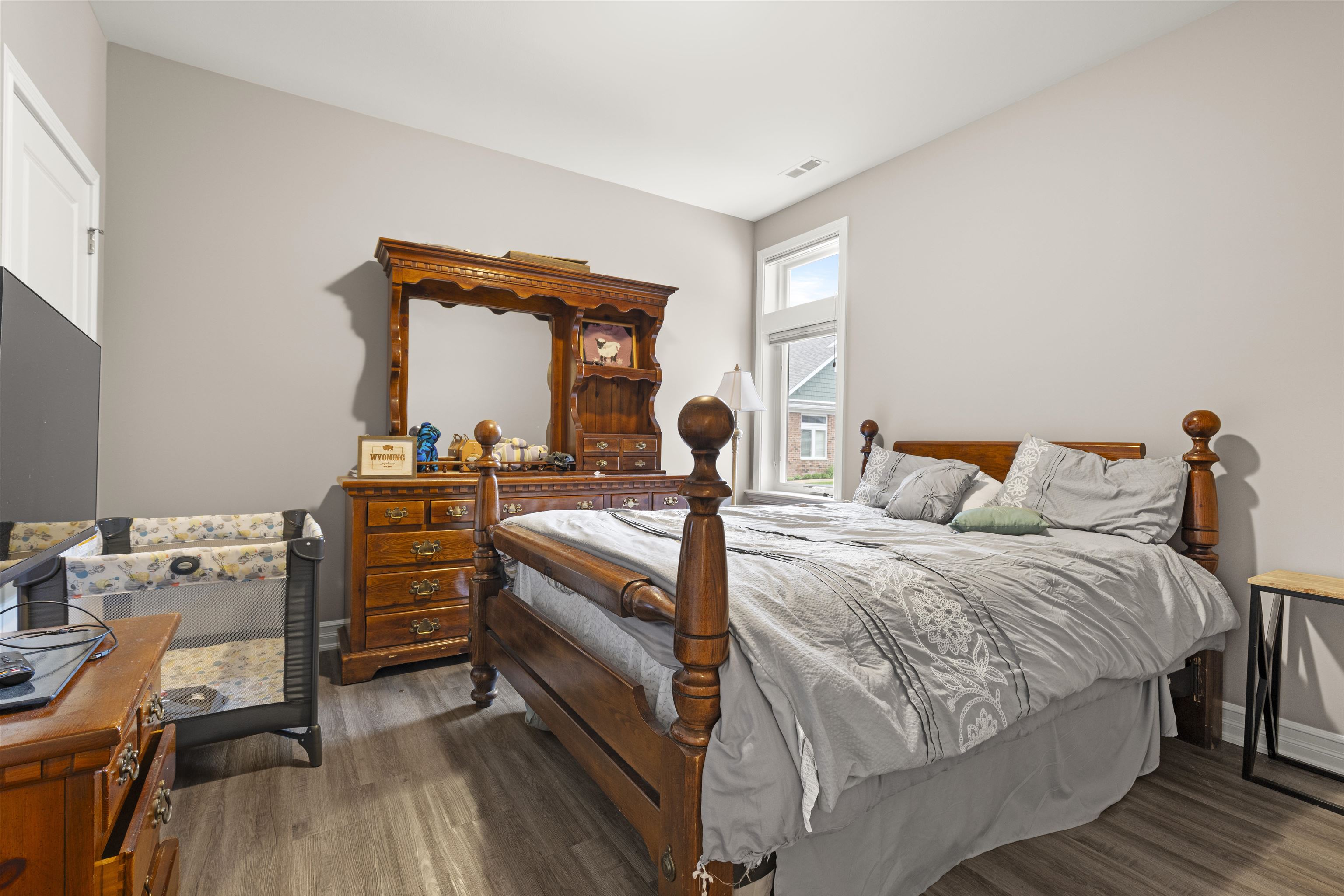 433 Stearn Drive Genoa, IL 60135 - Photo 13 of 24 a bedroom with a bed and wooden floor