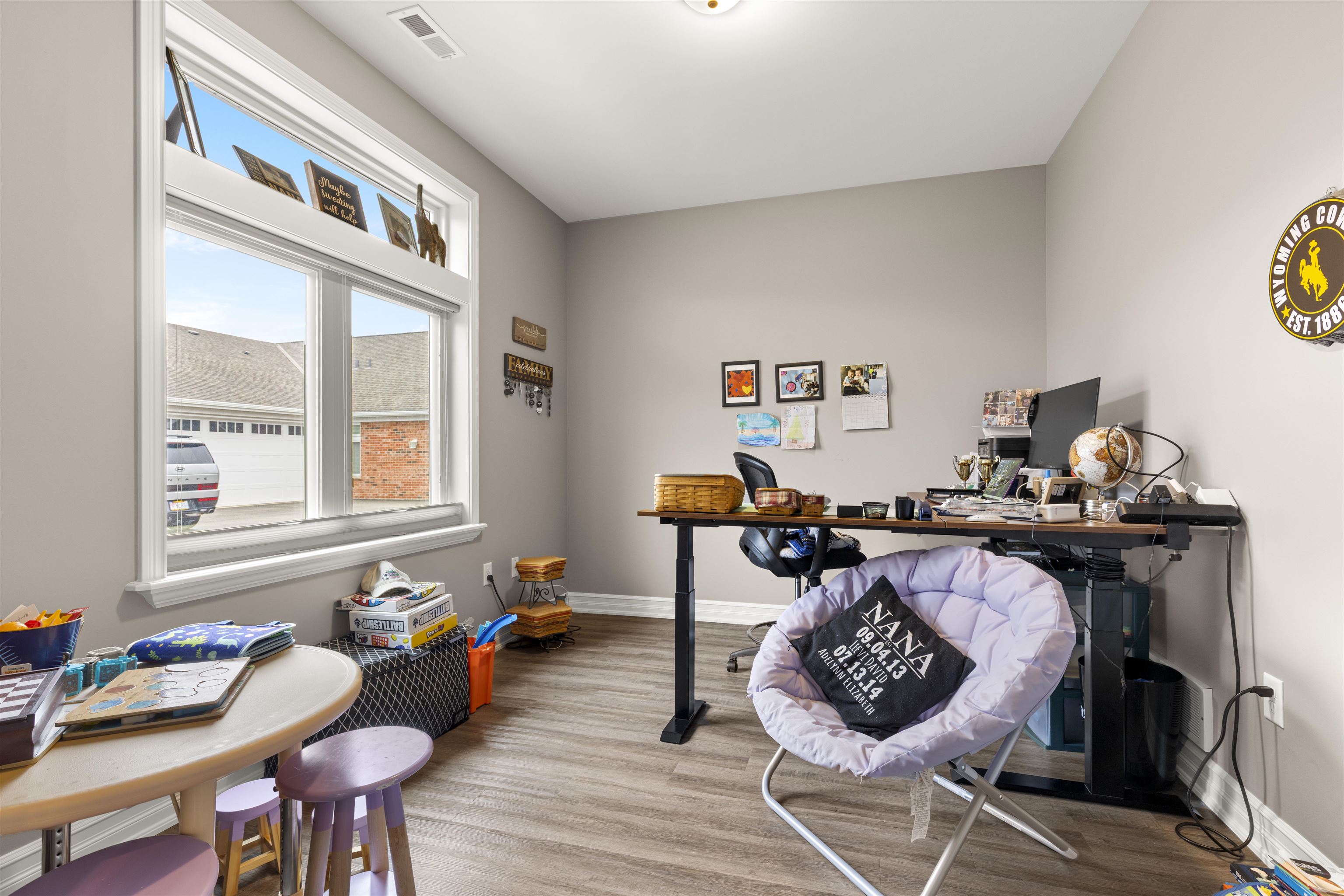 433 Stearn Drive Genoa, IL 60135 - Photo 14 of 24 a living room with furniture a rug and a window