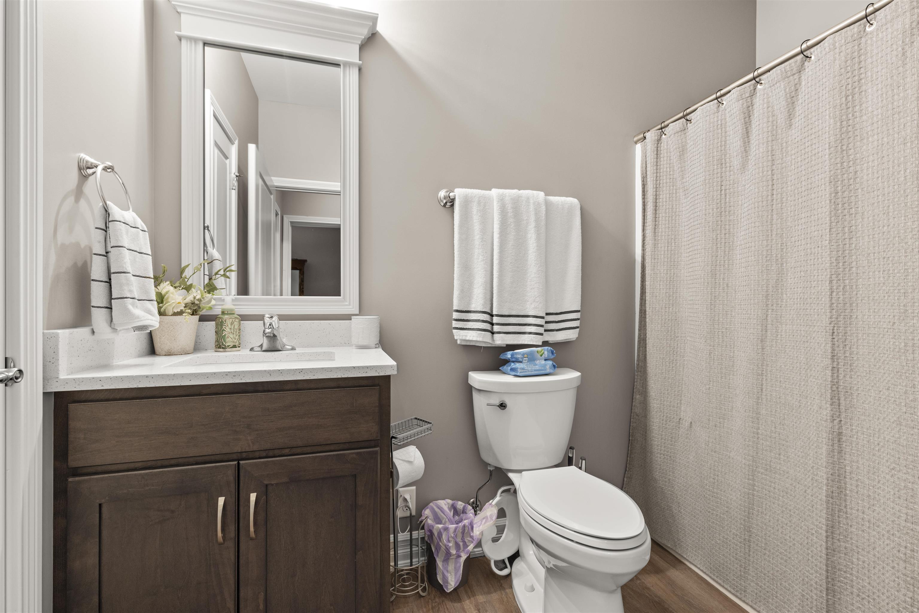 433 Stearn Drive Genoa, IL 60135 - Photo 16 of 24 a bathroom with a toilet sink and mirror