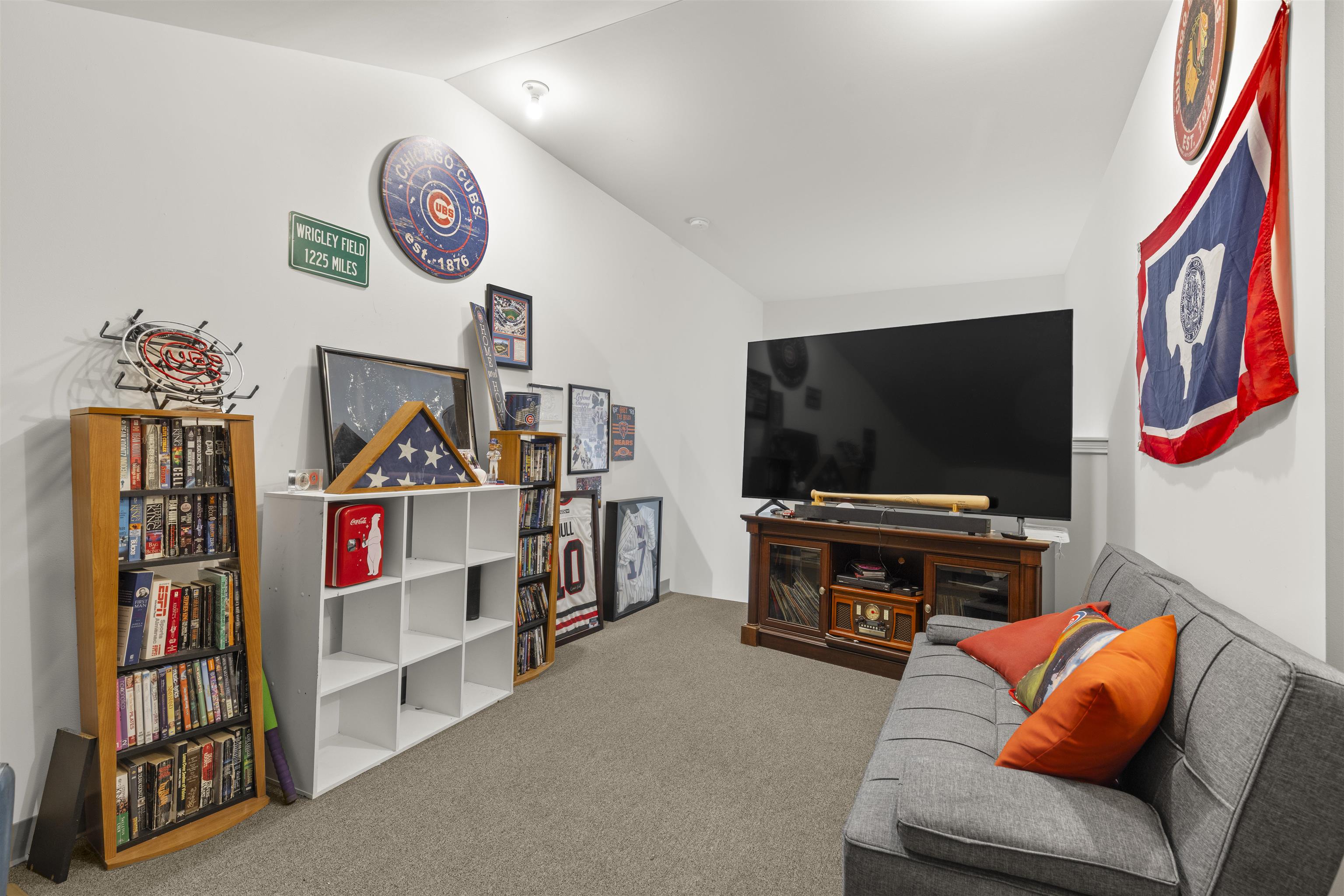 433 Stearn Drive Genoa, IL 60135 - Photo 18 of 24 a living room with furniture and a flat screen tv