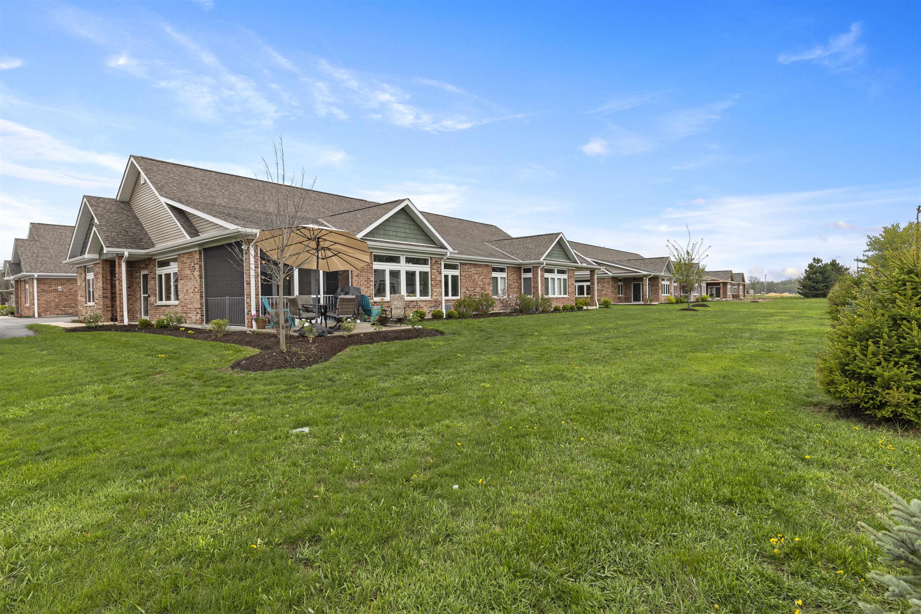 433 Stearn Drive Genoa, IL 60135 - Photo 23 of 24 a view of a house with a big yard and large trees