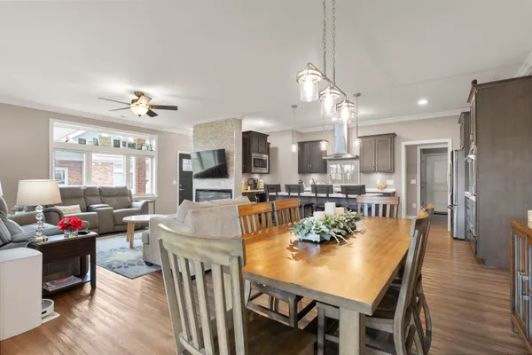 a view of a dining room with furniture window and wooden floor
