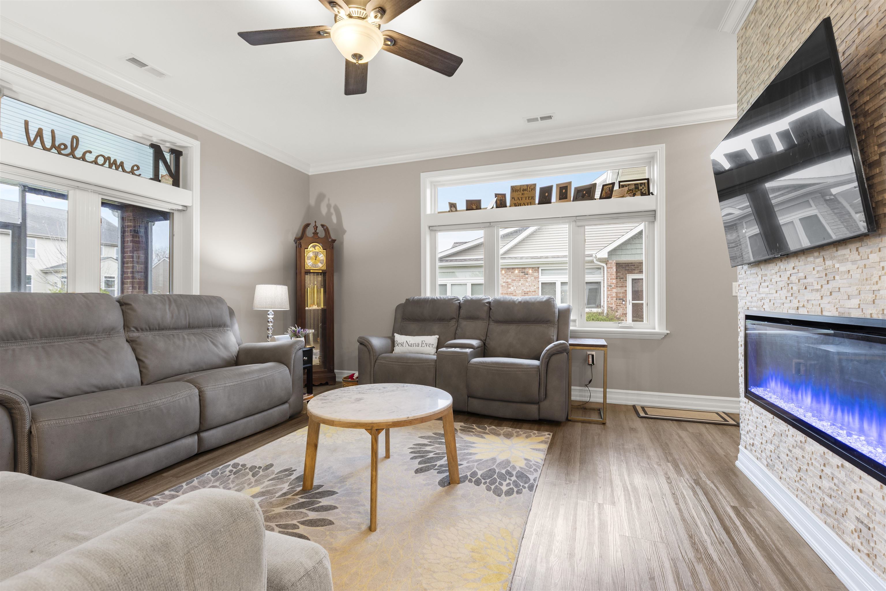 433 Stearn Drive Genoa, IL 60135 - Photo 6 of 24 a living room with furniture and a flat screen tv