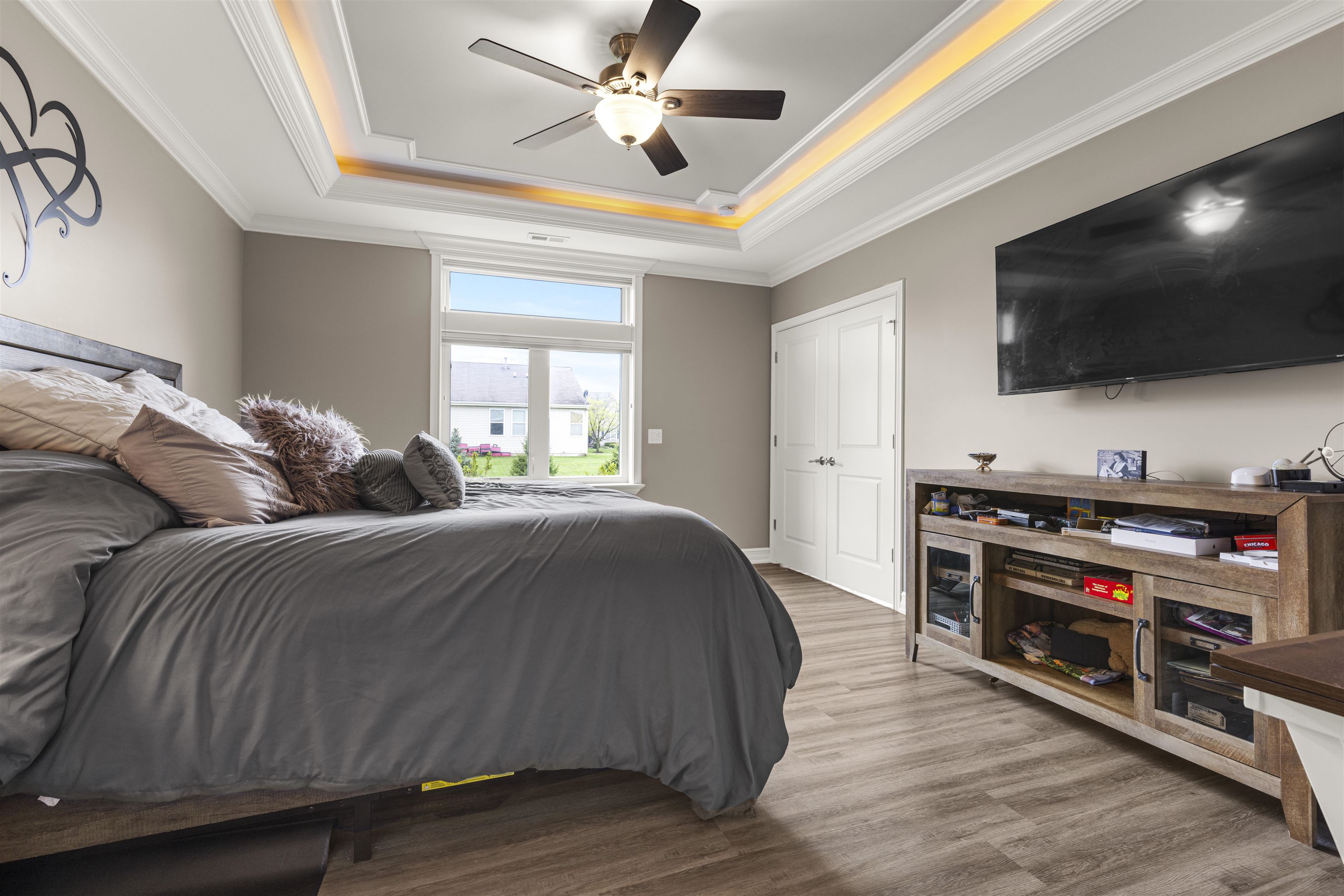 433 Stearn Drive Genoa, IL 60135 - Photo 8 of 24 a spacious bedroom with a bed and a flat screen tv