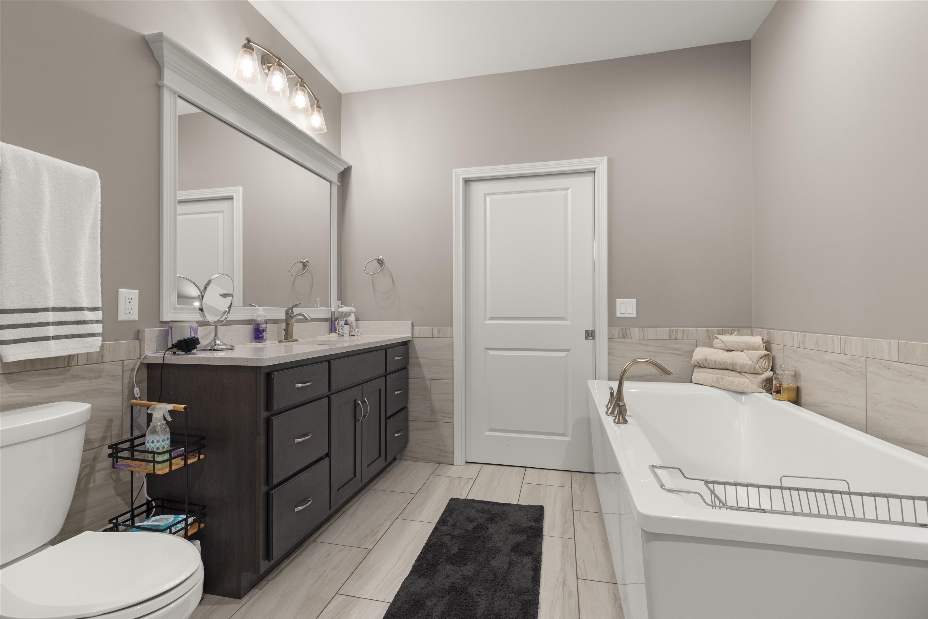 433 Stearn Drive Genoa, IL 60135 - Photo 9 of 24 a bathroom with a sink a toilet and vanity