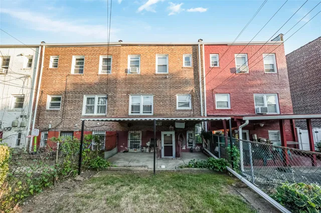 a view of a brick building with a porch