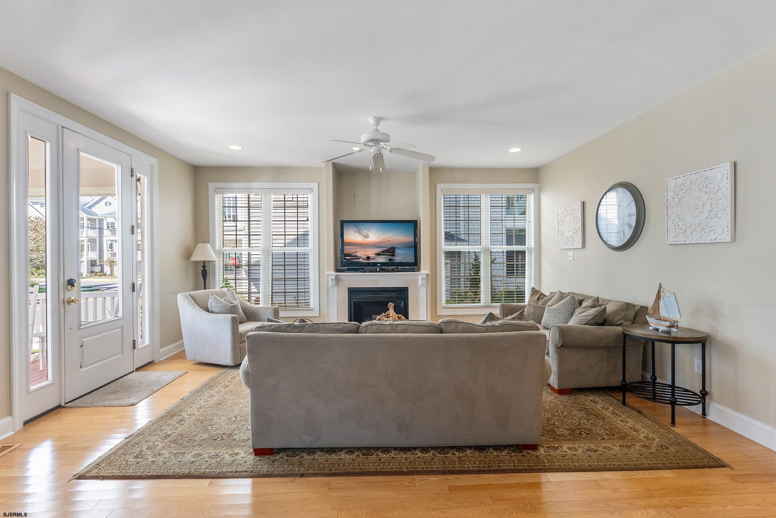 909 East 4th Street Ocean City, NJ 08226 - Photo 28 of 83 a living room with furniture and a large window