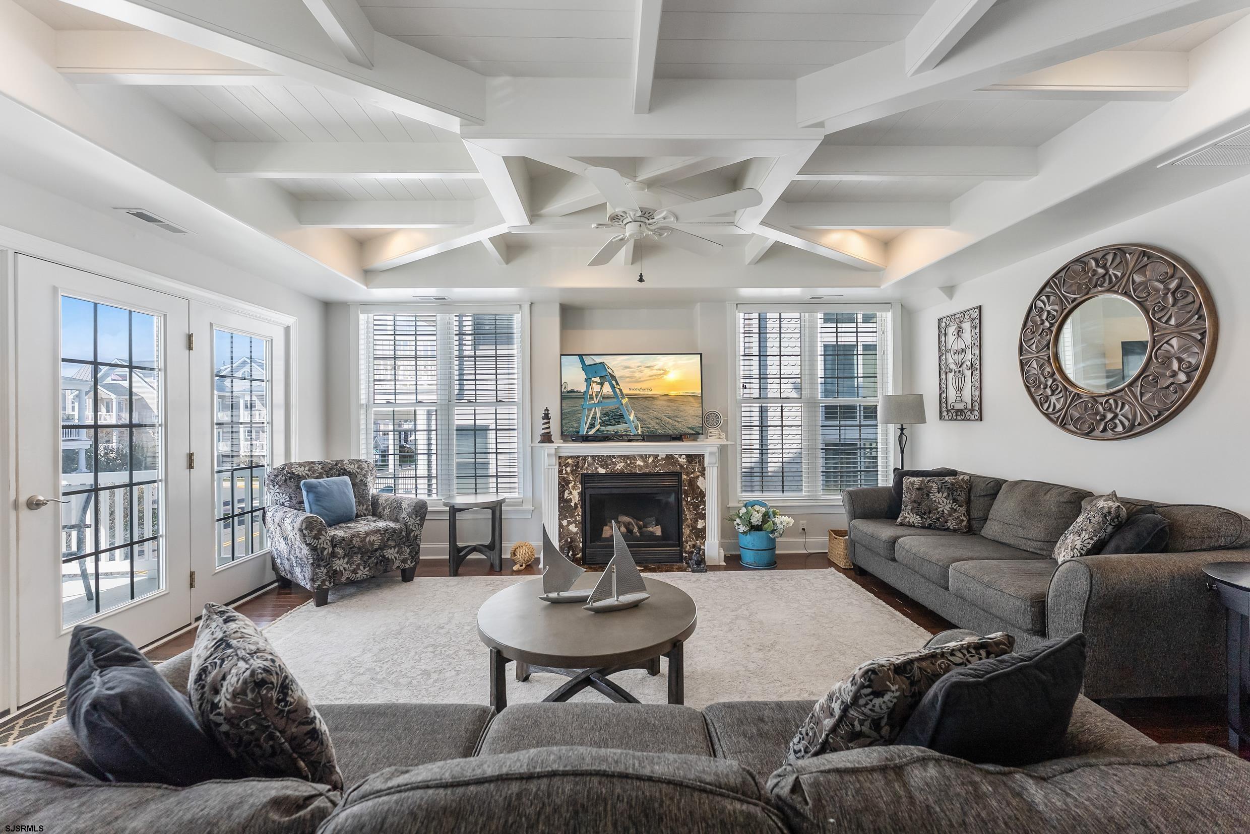 909 East 4th Street Ocean City, NJ 08226 - Photo 43 of 83 a living room with furniture and a fireplace