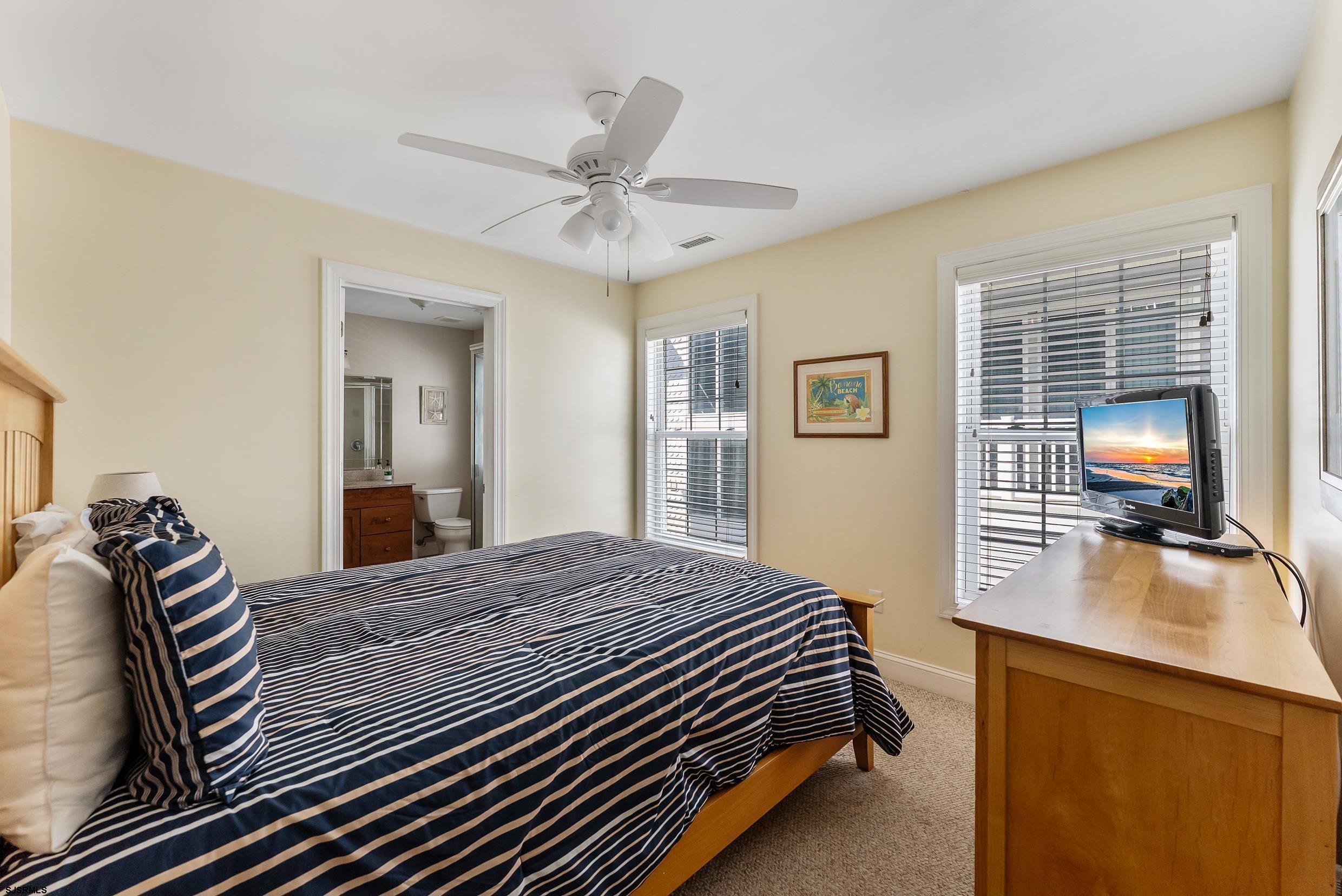 909 East 4th Street Ocean City, NJ 08226 - Photo 53 of 83 a bedroom with a bed and wooden floor