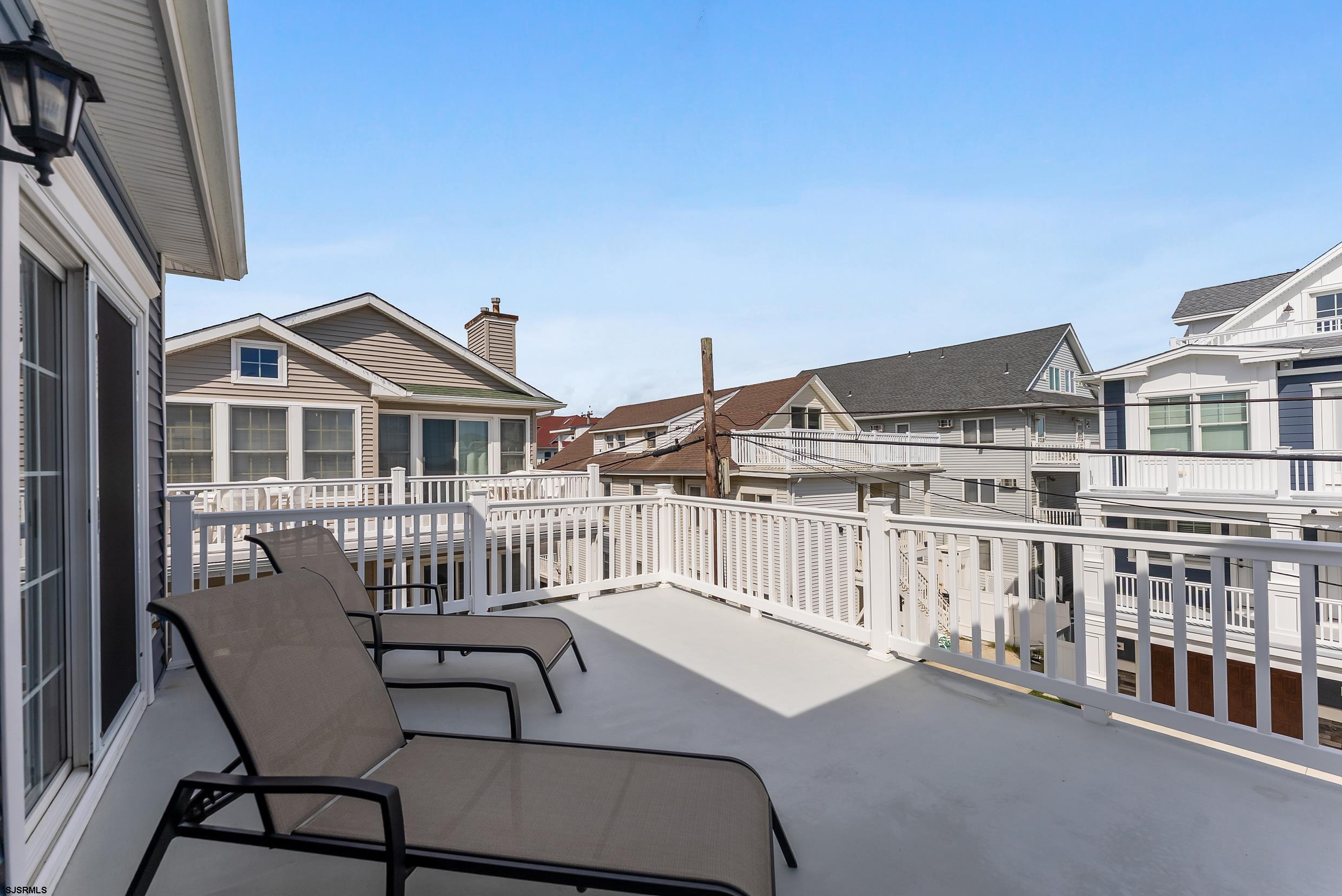 909 East 4th Street Ocean City, NJ 08226 - Photo 61 of 83 a view of a house with wooden deck