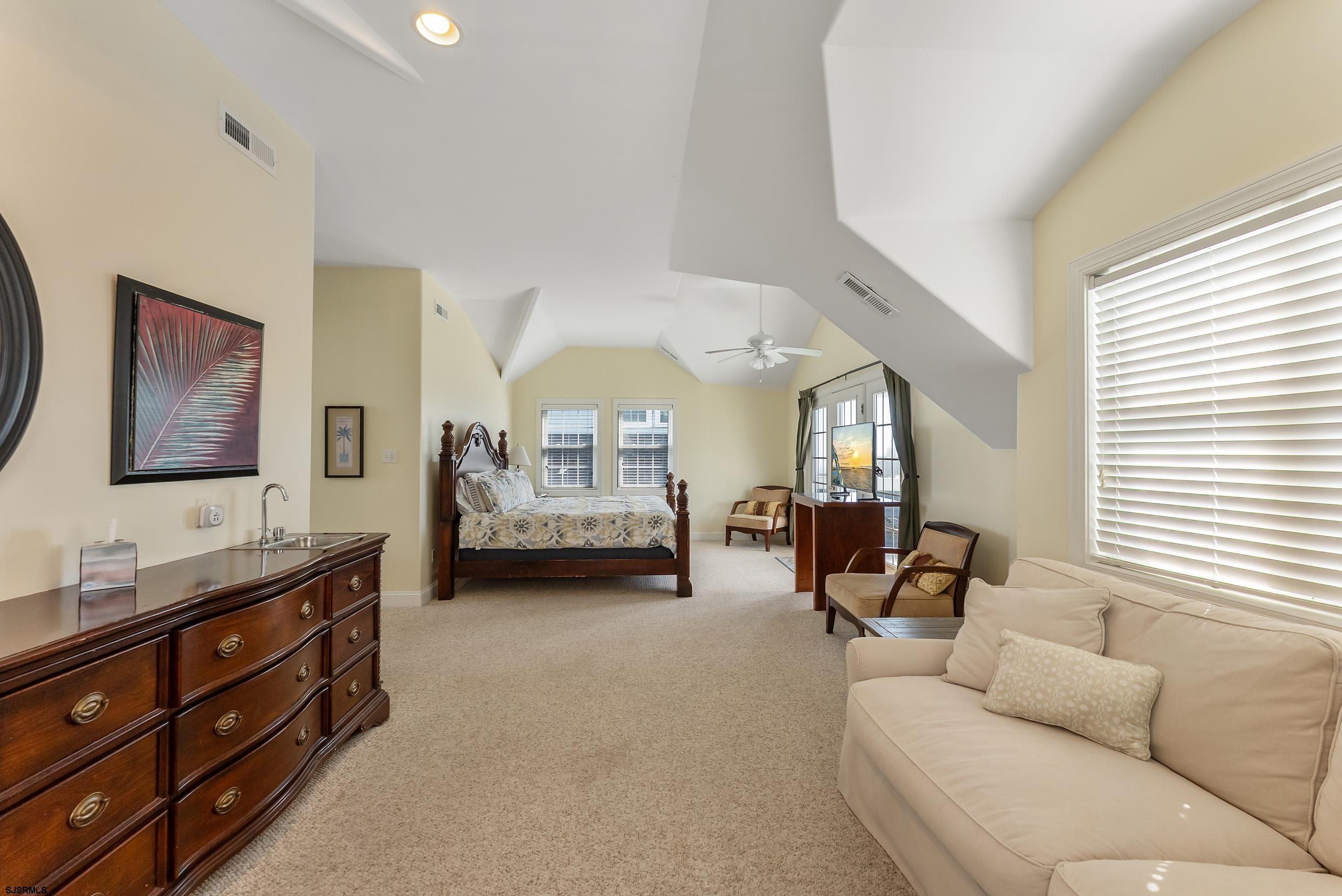 909 East 4th Street Ocean City, NJ 08226 - Photo 66 of 83 a living room with furniture and a window