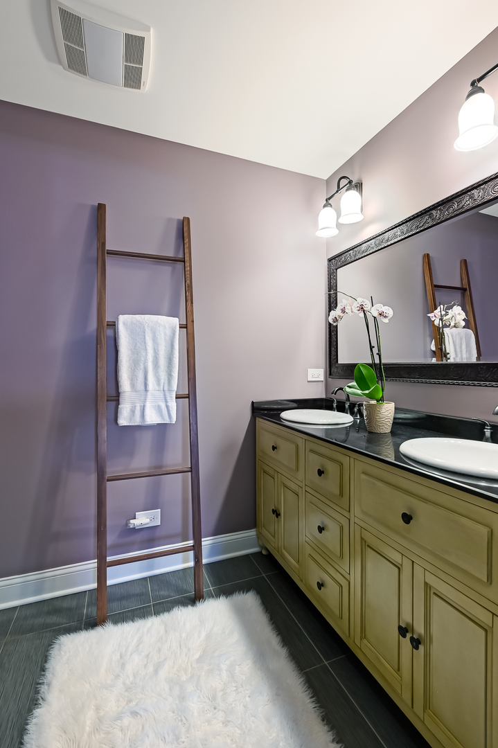 330 Village Road Willowbrook, IL 60527 - Photo 11 of 19 a bedroom with a bed and a dresser