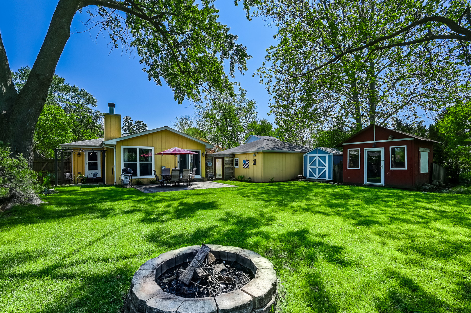 330 Village Road Willowbrook, IL 60527 - Photo 18 of 19 a front view of a house with a yard and trees