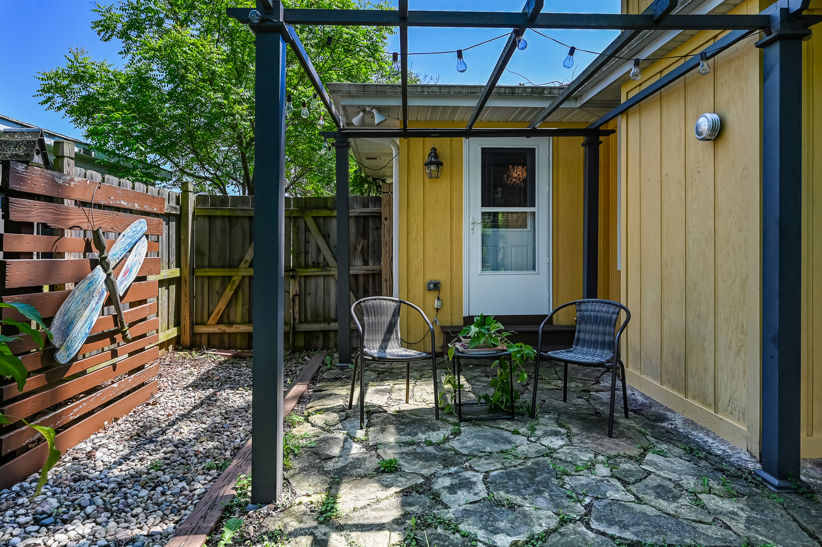 330 Village Road Willowbrook, IL 60527 - Photo 19 of 19 a backyard of a house with outdoor seating
