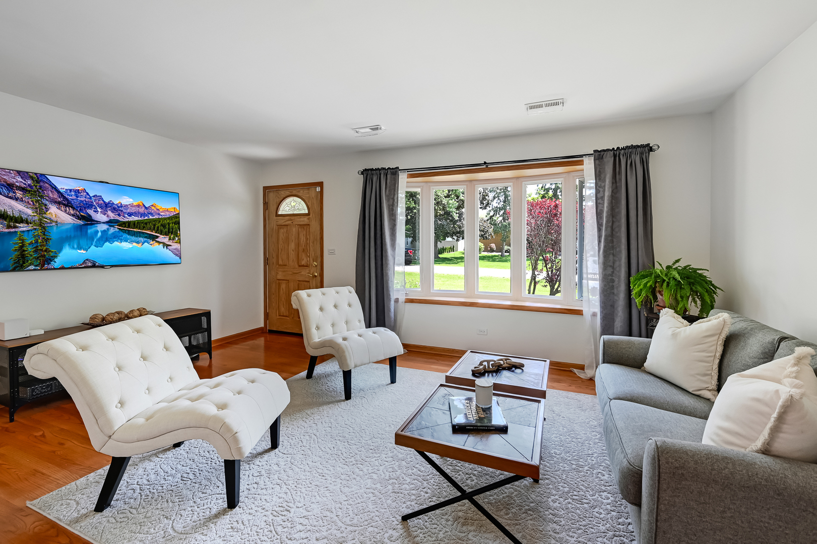 330 Village Road Willowbrook, IL 60527 - Photo 4 of 19 a living room with furniture and a large window
