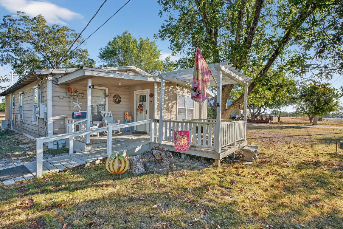 a view of a house with wooden fence
