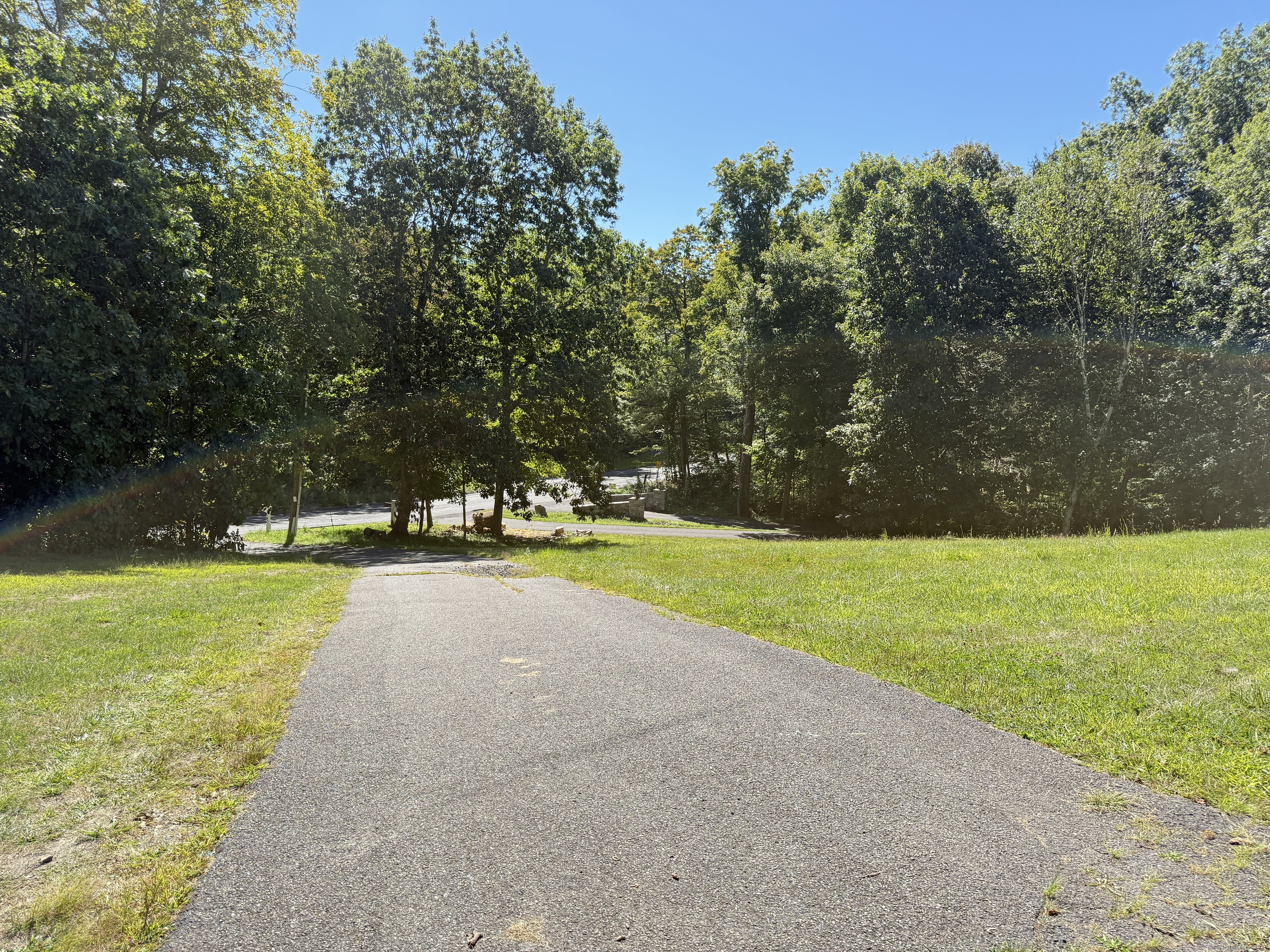 143 Bound Line Road Wolcott, CT 06716 - Photo 3 of 12 a view of a swimming pool and trees in the background