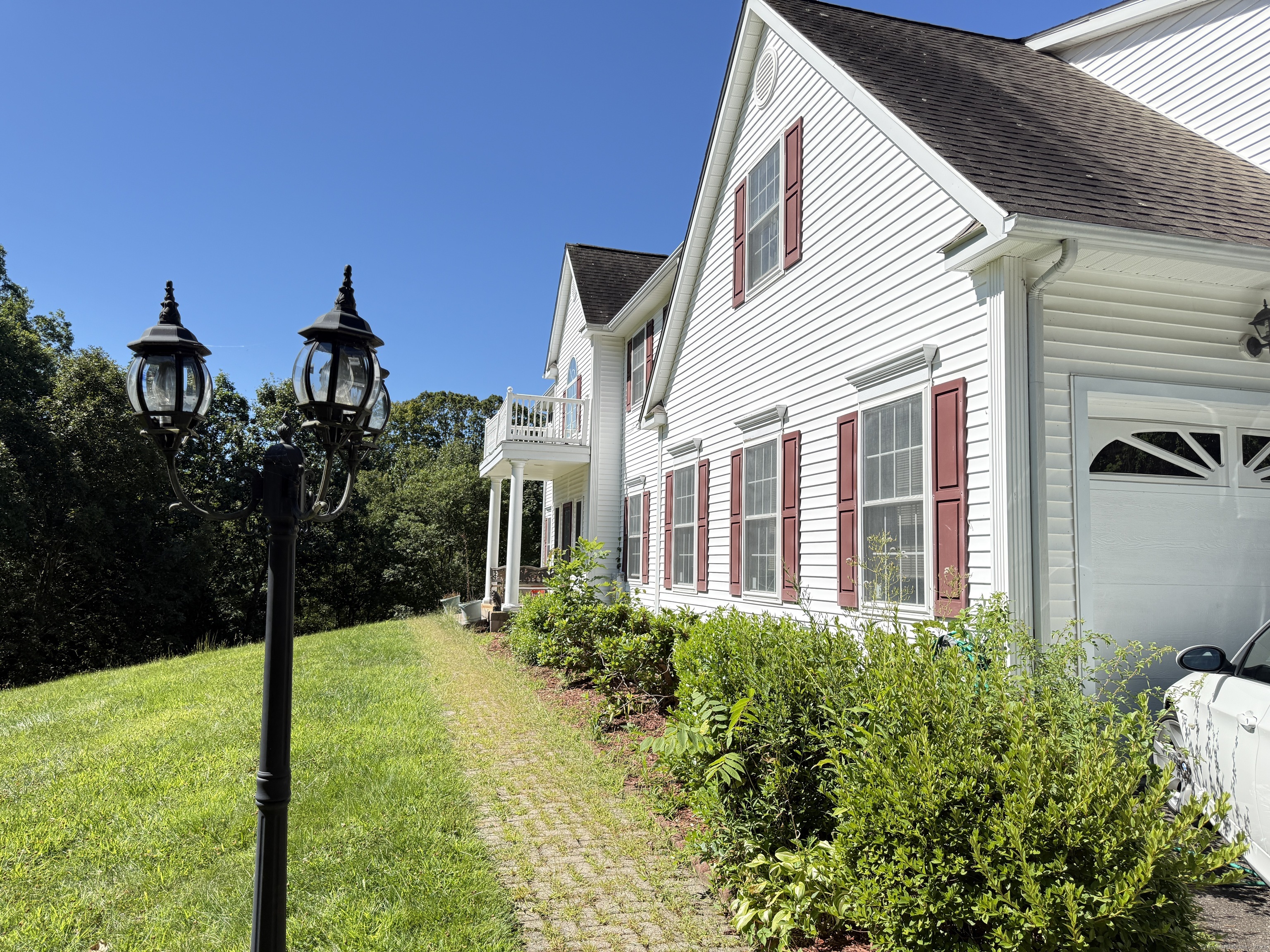 143 Bound Line Road Wolcott, CT 06716 - Photo 6 of 12 a view of a house with many windows next to a yard