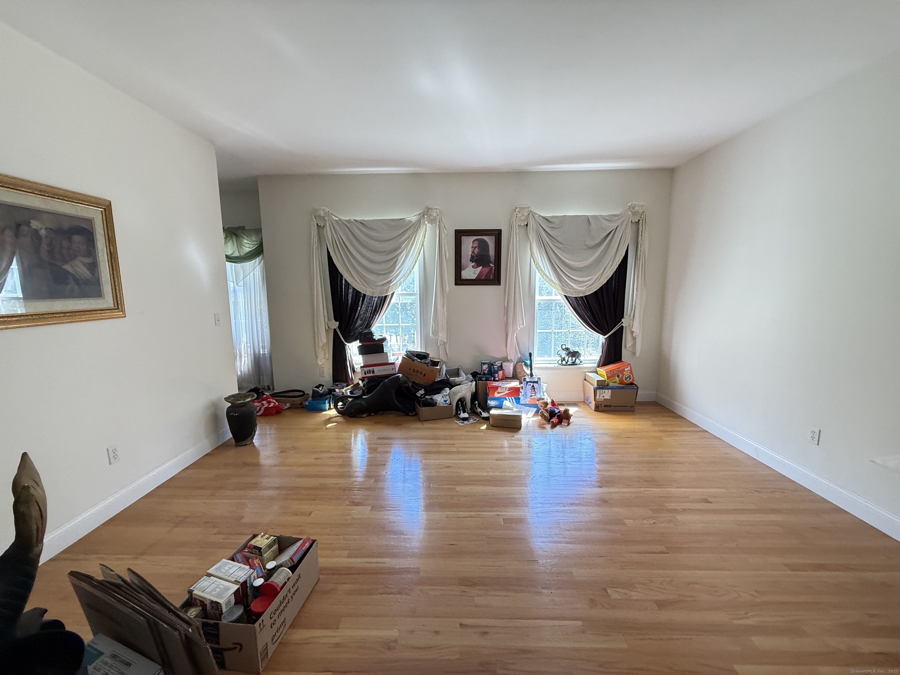143 Bound Line Road Wolcott, CT 06716 - Photo 7 of 12 a living room with furniture and a wooden floor