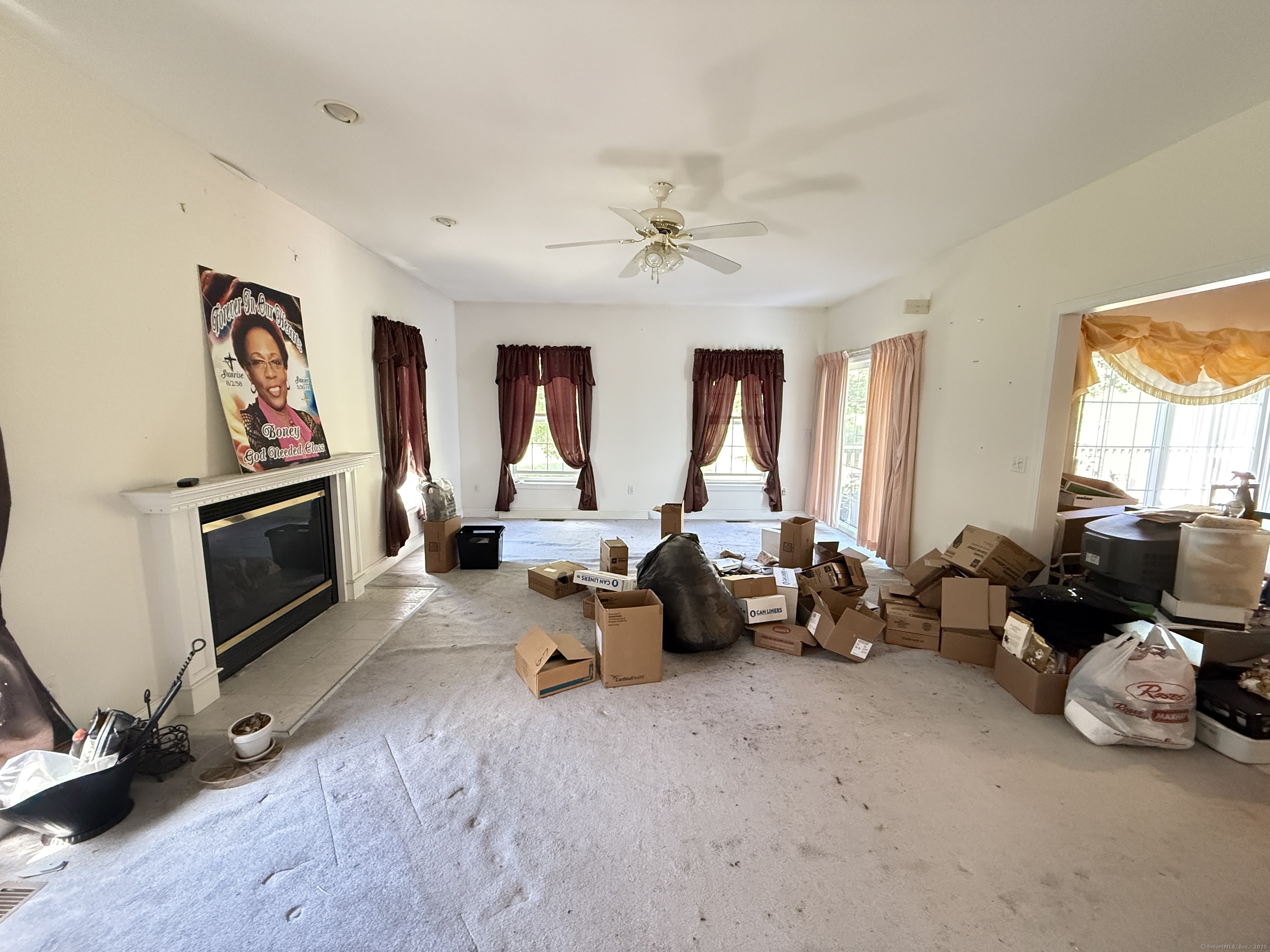 143 Bound Line Road Wolcott, CT 06716 - Photo 8 of 12 a living room with furniture gym equipment and a flat screen tv