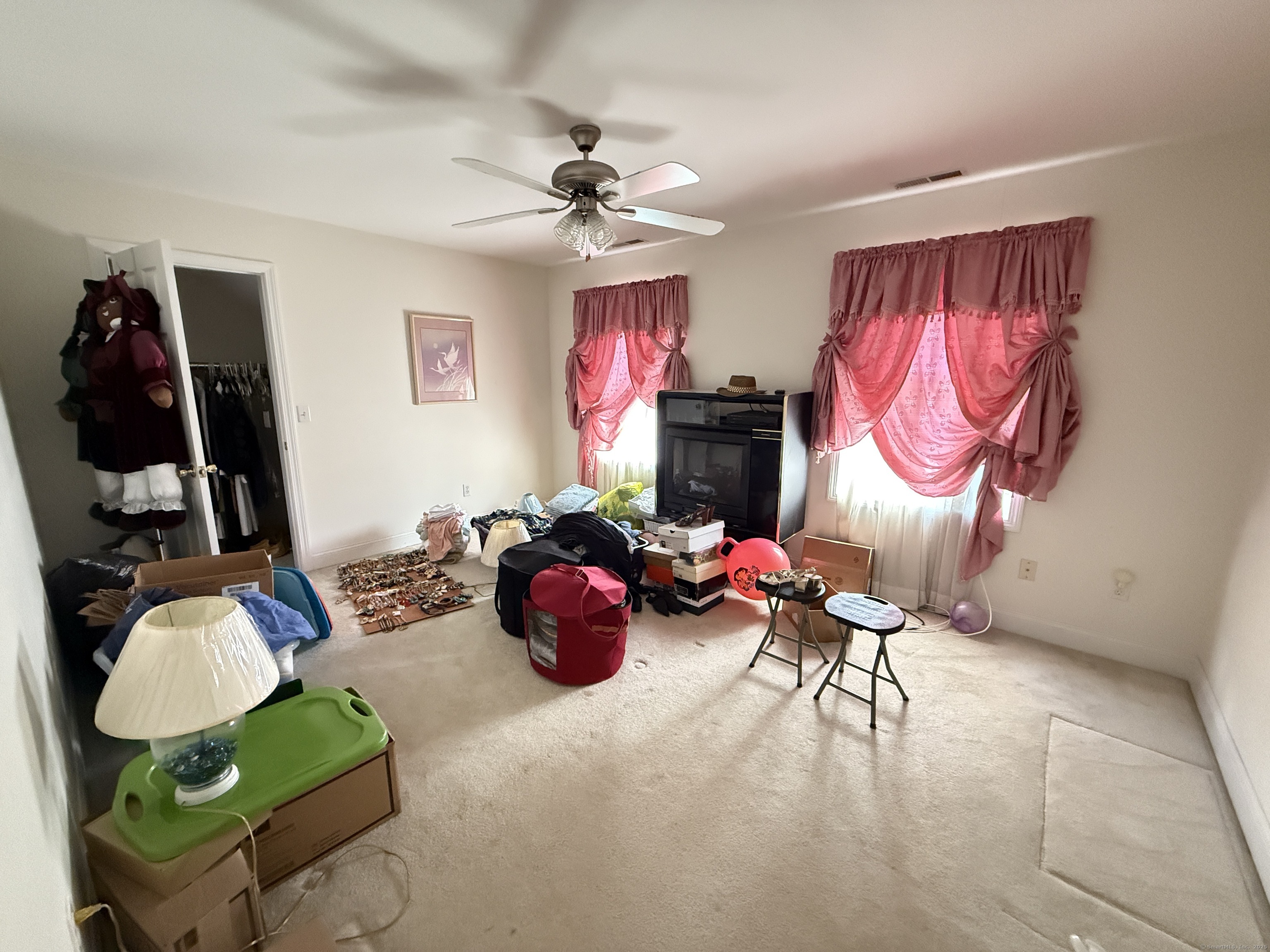 143 Bound Line Road Wolcott, CT 06716 - Photo 10 of 12 a living room with furniture a chandelier and a window