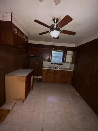 a kitchen with stainless steel appliances granite countertop a sink and a stove