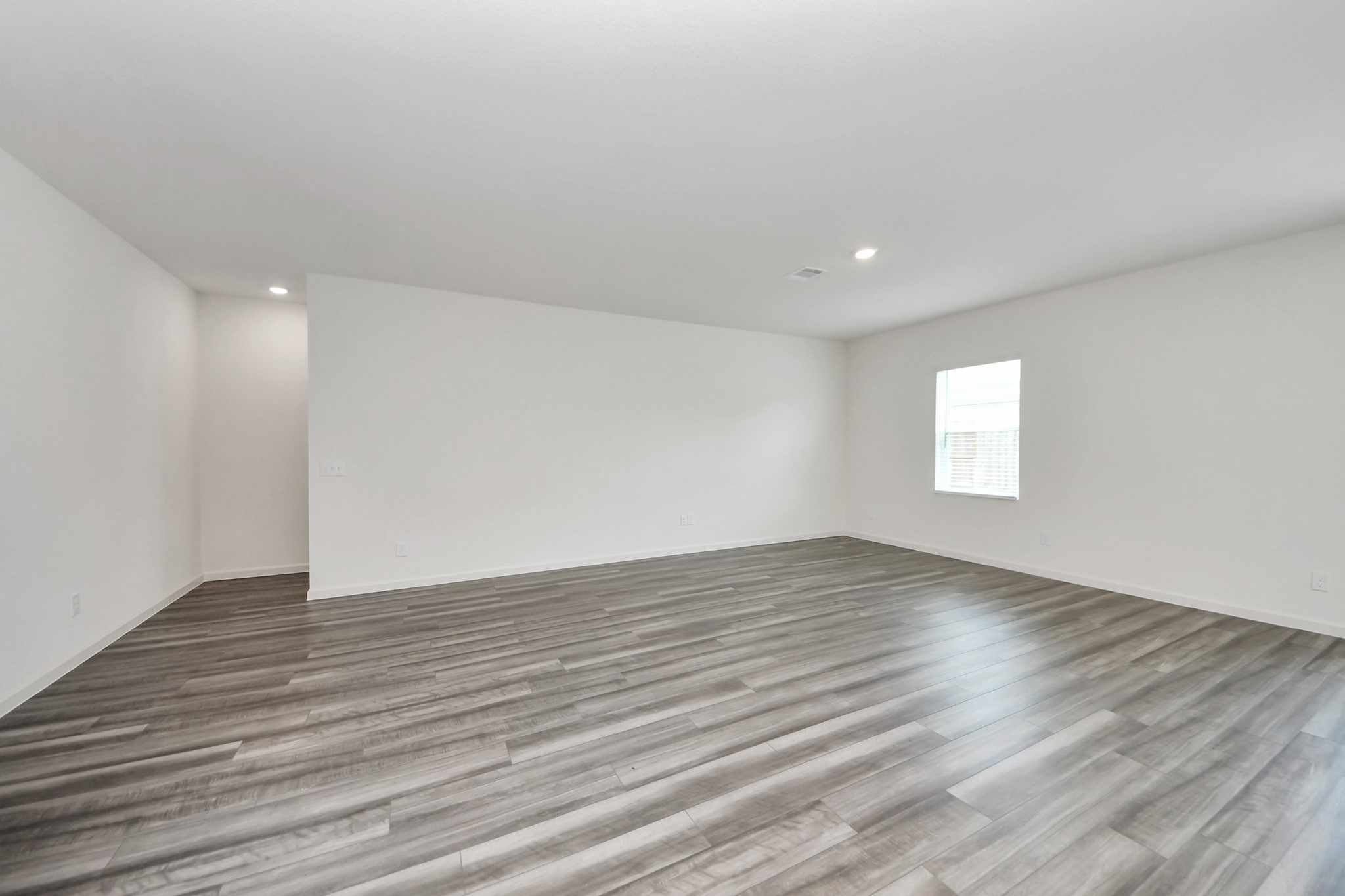 1812 Corsica Crk Lane Rosharon, TX 77583 - Photo 15 of 48 a view of an empty room with wooden floor and a window
