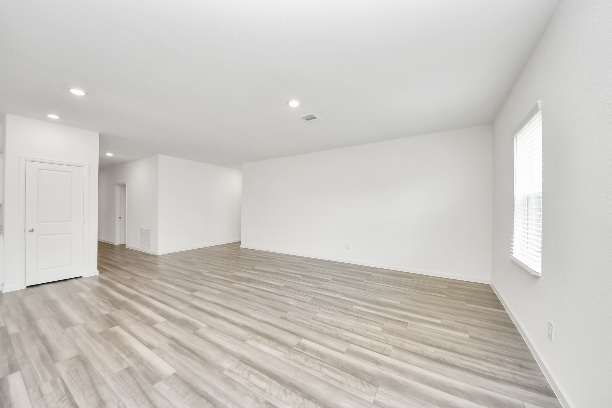 1812 Corsica Crk Lane Rosharon, TX 77583 - Photo 26 of 48 a view of an empty room with wooden floor and a window