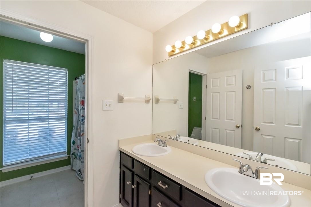6601 Conde Court Mobile, AL 36695 - Photo 22 of 30 Bathroom with vanity and tile patterned flooring