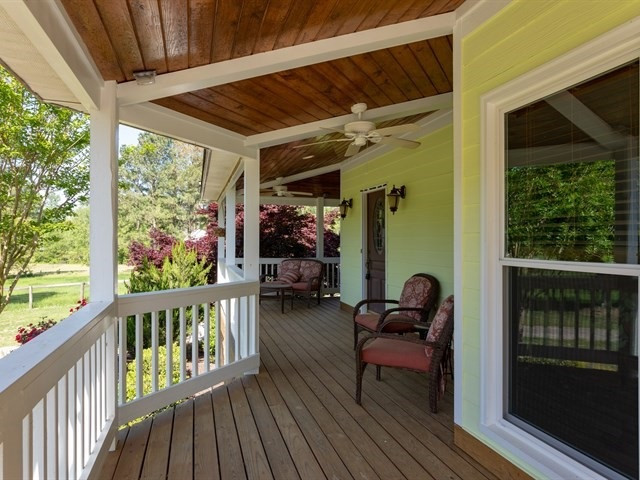 6421 Robertson Pond Road Wendell, NC 27591 - Photo 2 of 25 33 foot wrap around porch