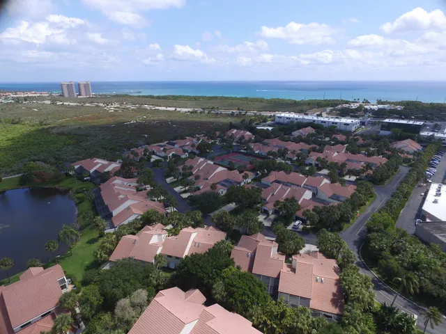 an aerial view of residential houses with outdoor space