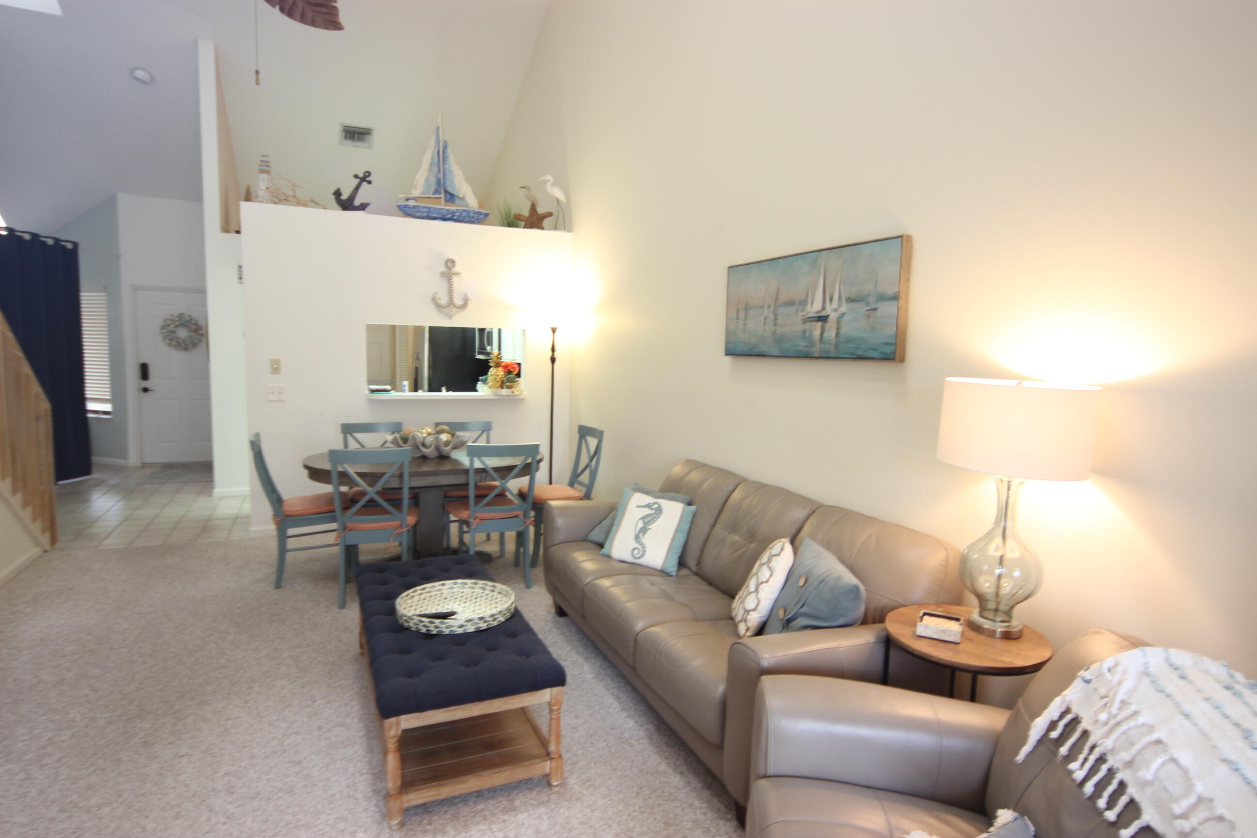 508 Sea Oats Drive, Unit B4 Juno Beach, FL 33408 - Photo 6 of 26 a living room with furniture and a lamp