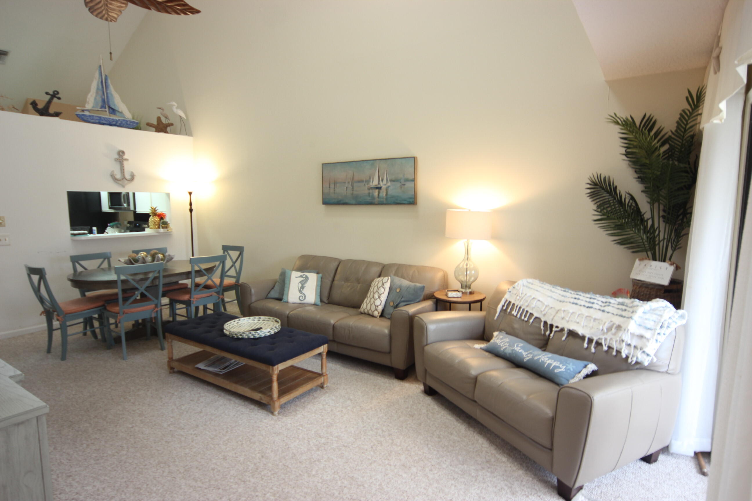508 Sea Oats Drive, Unit B4 Juno Beach, FL 33408 - Photo 7 of 26 a living room with furniture and a flat screen tv