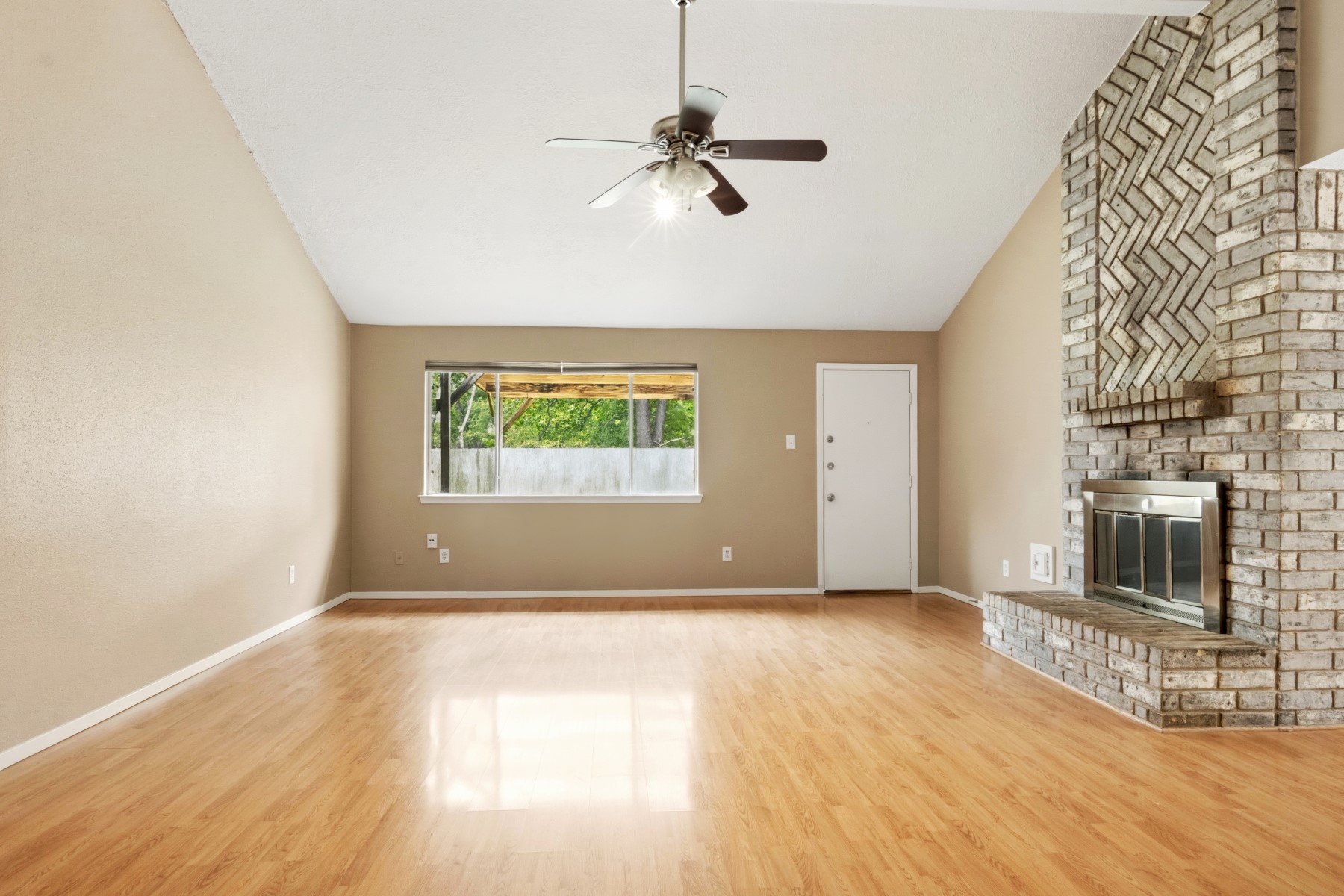 2531 North Spring Drive Spring, TX 77373 - Photo 5 of 24 a view of an empty room with a window and a fireplace