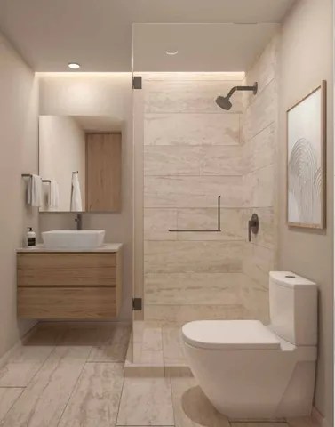 a bathroom with a toilet sink and shower