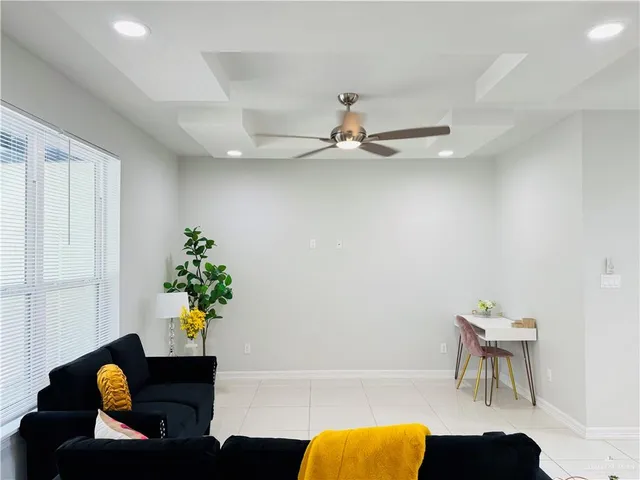 a kitchen with stainless steel appliances a refrigerator sink and wooden cabinets