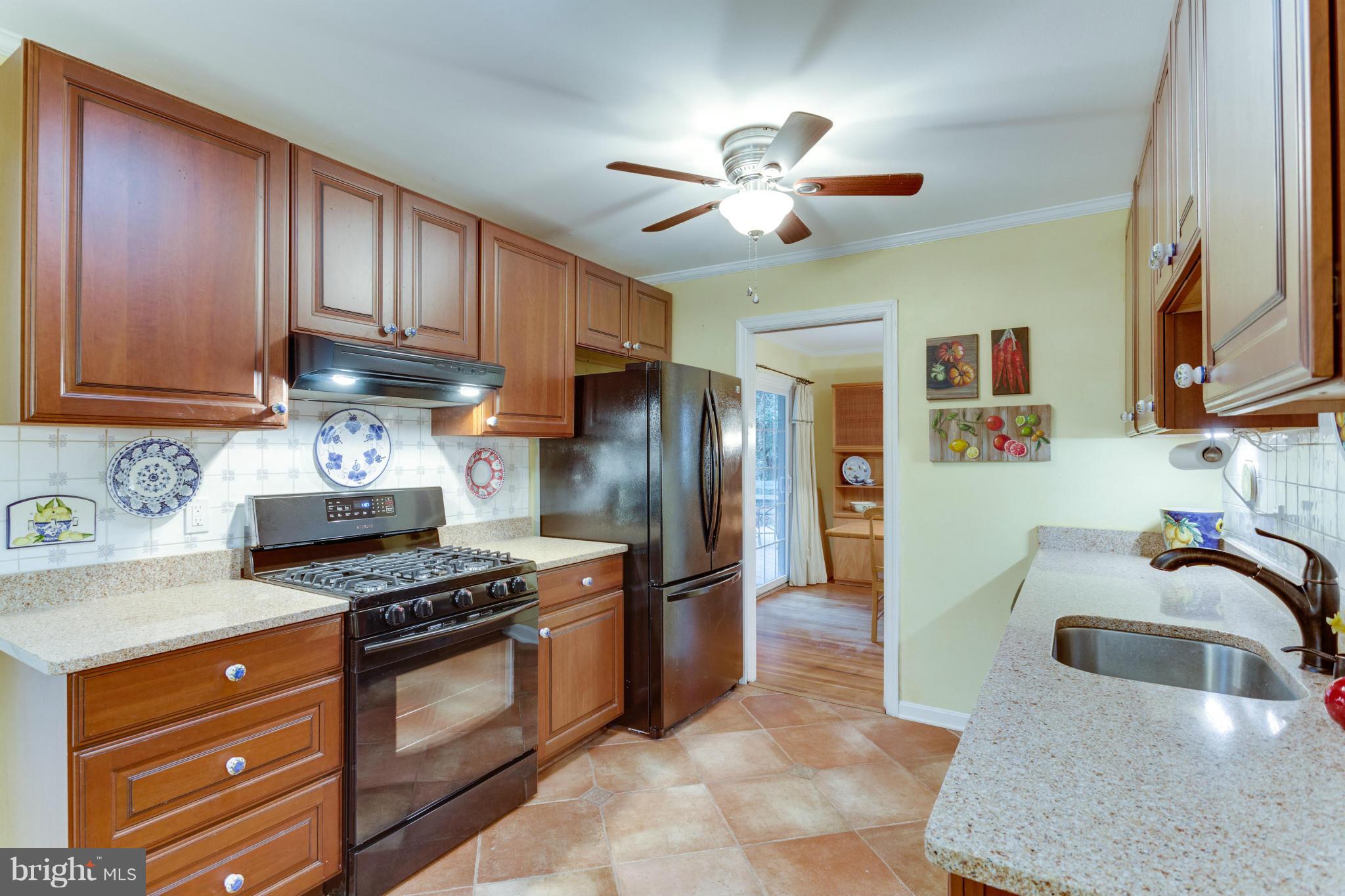 9810 Vale Road Vienna, VA 22181 - Photo 2 of 30 a kitchen with stainless steel appliances granite countertop a sink stove and refrigerator