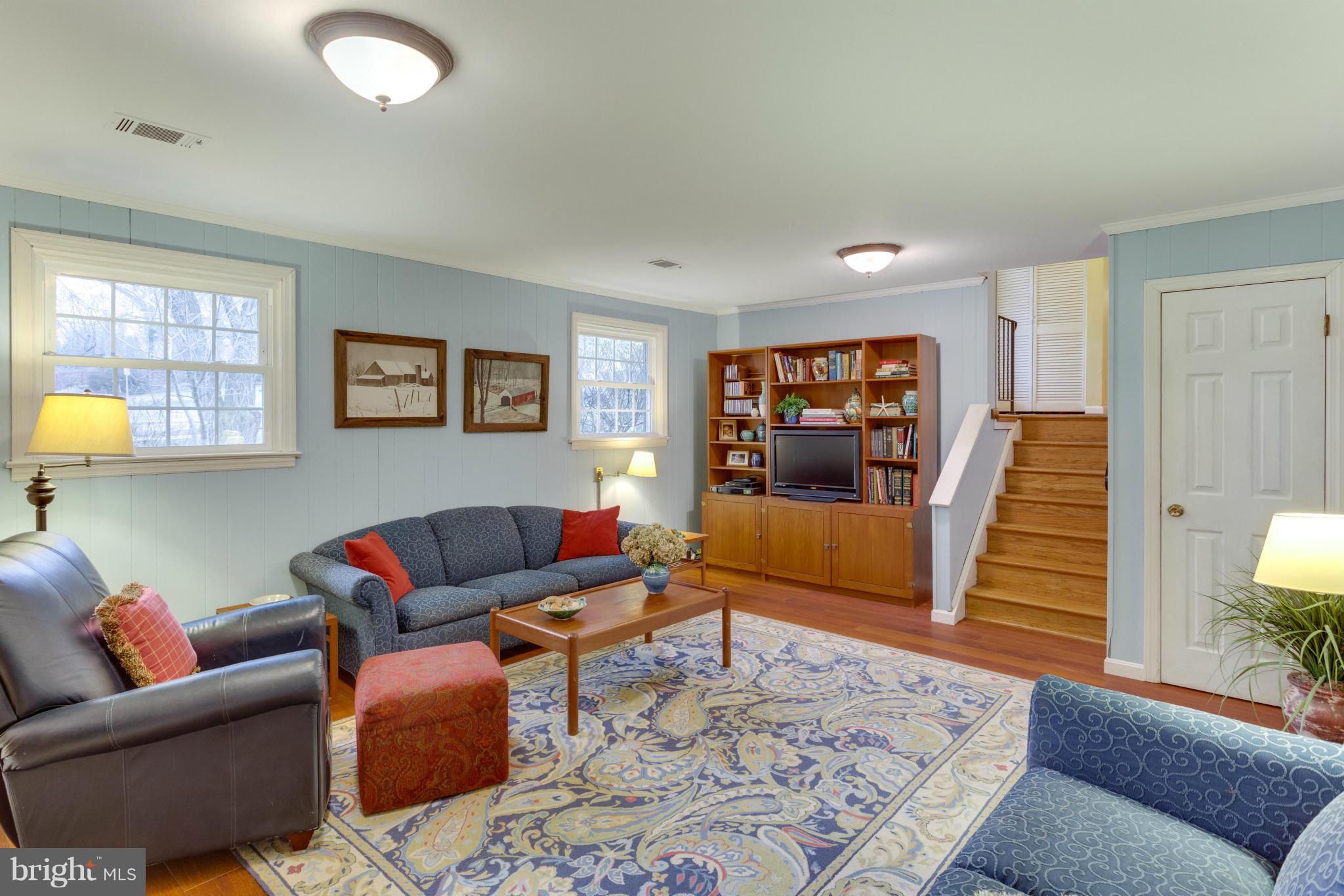 9810 Vale Road Vienna, VA 22181 - Photo 18 of 30 a living room with furniture and a wooden floor