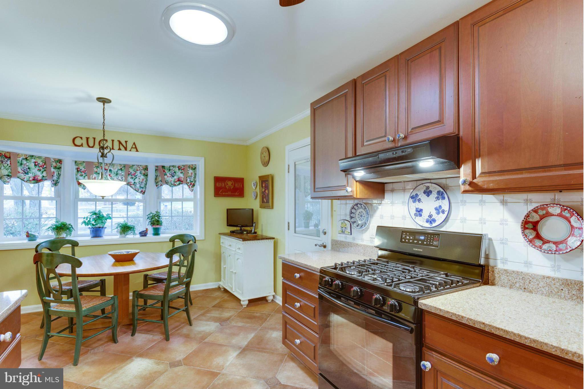 9810 Vale Road Vienna, VA 22181 - Photo 3 of 30 a kitchen with a stove and a refrigerator