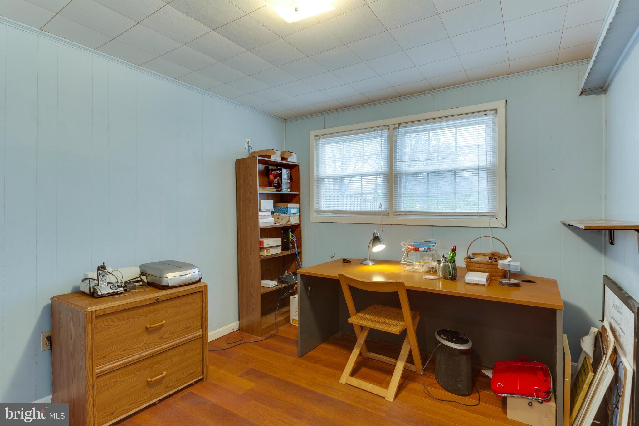 9810 Vale Road Vienna, VA 22181 - Photo 20 of 30 a room with furniture cabinets and a window