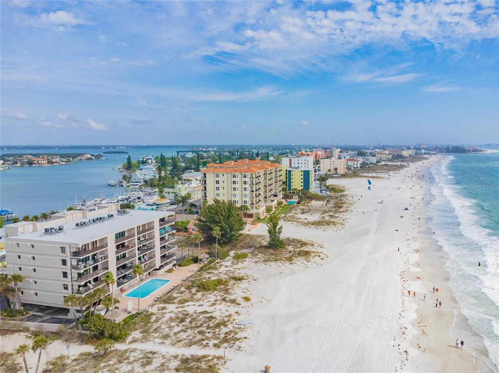 13650 Gulf Boulevard, Unit 402 Madeira Beach, FL 33708 - Photo 2 of 44 a view of a city with ocean