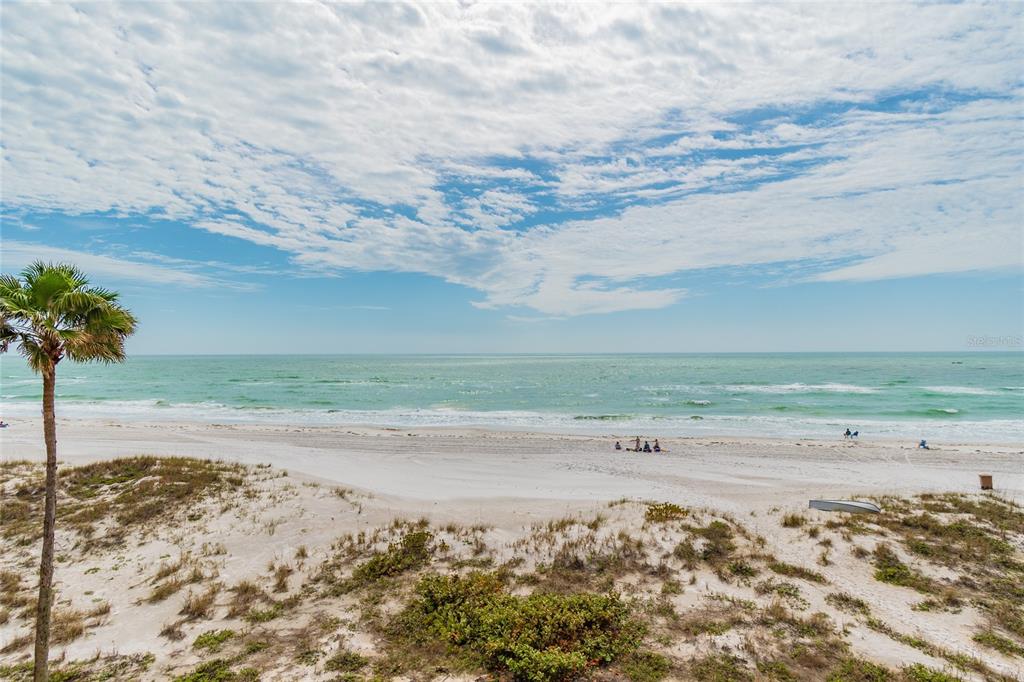 13650 Gulf Boulevard, Unit 402 Madeira Beach, FL 33708 - Photo 31 of 44 a view of beach and ocean