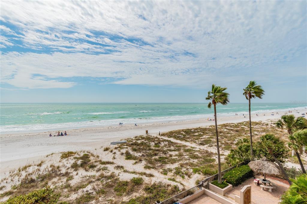 13650 Gulf Boulevard, Unit 402 Madeira Beach, FL 33708 - Photo 33 of 44 a view of an ocean beach