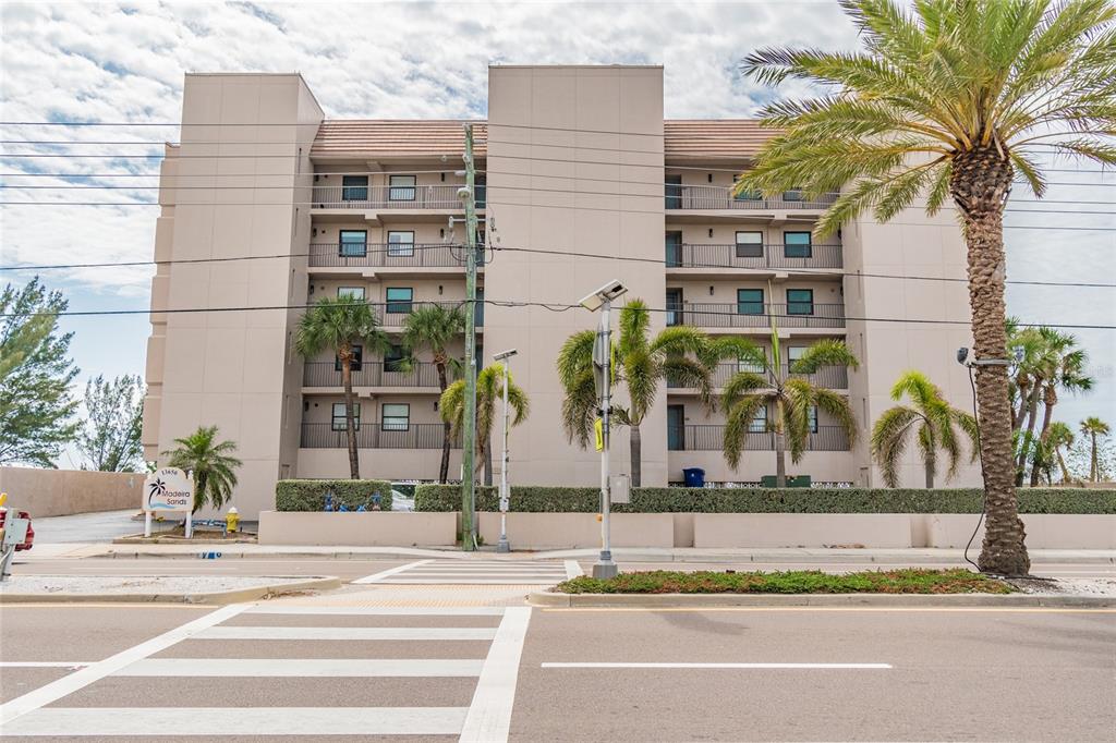 13650 Gulf Boulevard, Unit 402 Madeira Beach, FL 33708 - Photo 38 of 44 a view of a building with a tree