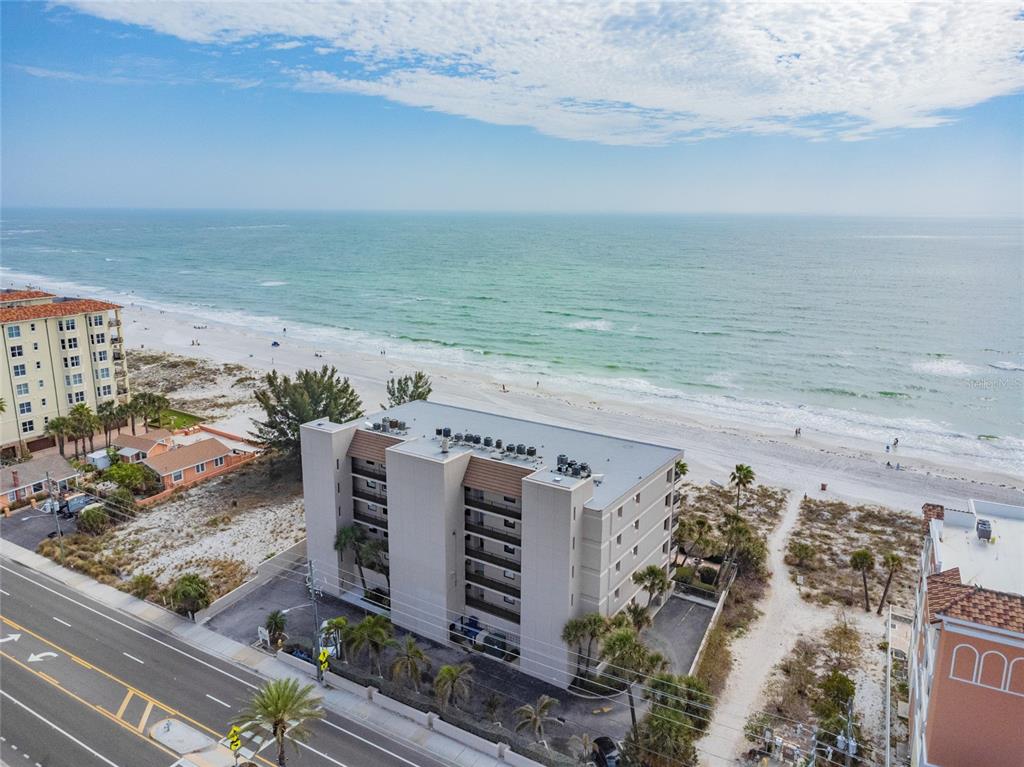 13650 Gulf Boulevard, Unit 402 Madeira Beach, FL 33708 - Photo 42 of 44 a view of beach and ocean