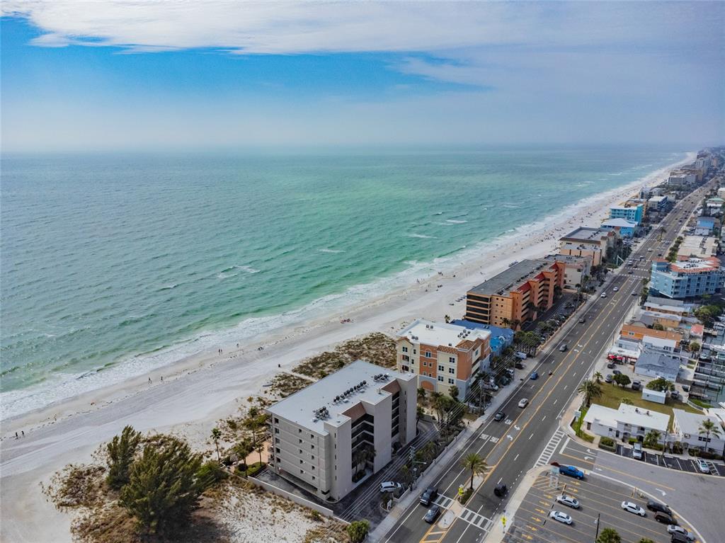 13650 Gulf Boulevard, Unit 402 Madeira Beach, FL 33708 - Photo 43 of 44 a view of an ocean with beach and balcony