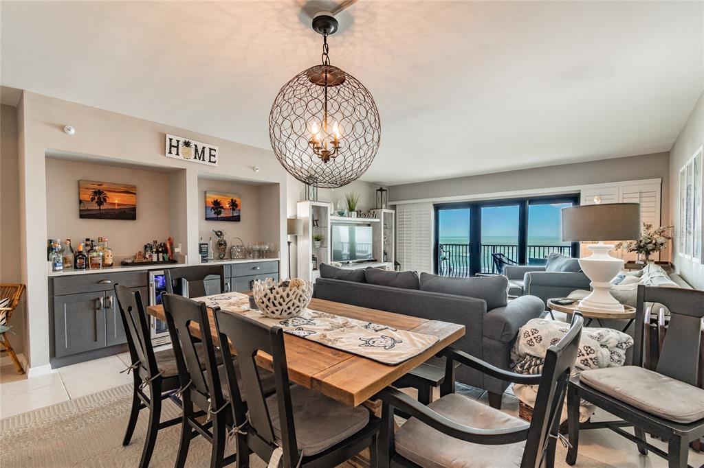 13650 Gulf Boulevard, Unit 402 Madeira Beach, FL 33708 - Photo 8 of 44 a view of a dining room with furniture window and wooden floor