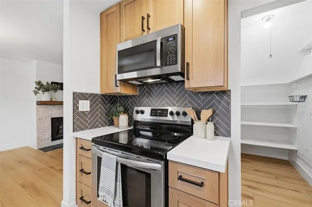 a kitchen with a stove and a microwave