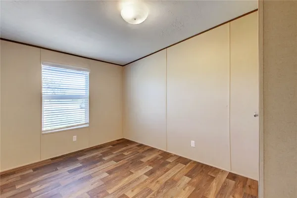a living room with lots of furniture and kitchen view